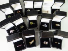 Sixteen dress rings in boxes together with a small diamond cluster & including green quartz,