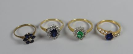 Four yellow metal multi-coloured stone dress rings, some marked 14k