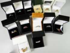 Sixteen dress rings in boxes including rainbow sapphire, tanzanite, opal etc mainly TV shopping