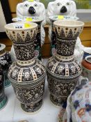 A pair of continental pottery vases