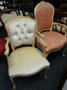 A pair of reproduction lightwood carved French-style armchairs