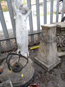 Composite stone ornamental sun dial on stand together with a similar garden statue (outside)