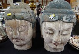 Two large carved wooden & painted Buddha heads
