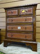 A miniature chest of three long & two short drawers