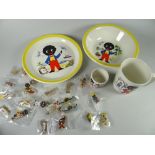 A parcel of Robinson's golly badges together with a vintage Robinson's golly breakfast set
