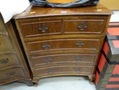 A reproduction chest of three long & two short drawers