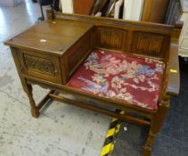 A carved & linen fold telephone seat