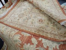 A large rust & cream coloured patterned rug