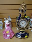 A reproduction gilt & blue French Marie Antoinette-style mantel clock in the form of a lyre together