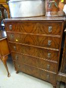 A vintage chest of five long drawers