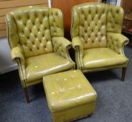 A pair of good buttoned leather wingback gentleman's club-type arm chairs & matching stool