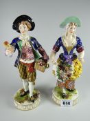 Two porcelain figures, male & female flower carriers, possible Crown Derby