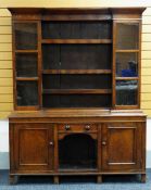 Nineteenth century oak two-stage dresser, the cabinet back having three central open shelves,