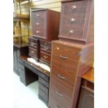 A wood effect filing cabinet, two pairs of bedside drawers etc