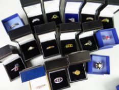 Nineteen dress rings in boxes, mainly QVC purchases, some with low gold content including tanzanite,