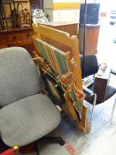 A vintage classic striped folding deck chair, an office chair & another