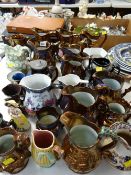 A quantity of mixed antique jugs including copper lustre