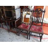 A pair of antique carved chairs, an occasional table & a mirror