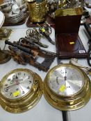 A nautical-type clock & barometer set, ornamental cannons etc