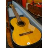 A cased Japanese acoustic guitar