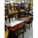 A reproduction twin-pedestal mahogany extending dining table & 4+2 chairs