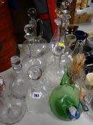 A collection of clear glass drinking decanters, pottery & pewter drinking mugs etc