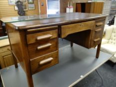 A vintage office desk with long centre drawer & two banks of three drawers