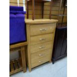 A modern lightwood five-drawer chest