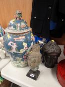Two Buddha heads & a reproduction Oriental baluster jar & cover