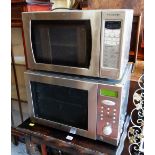 Two silver microwaves ovens E/T