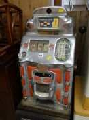 A retro chromed Standard Chief penny slot machine