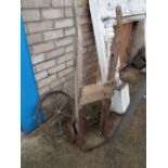 Decorative cast iron cart wheel together with a distressed sack truck (outside)