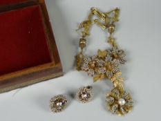 Small jewellery box containing a yellow metal & pearl effect necklace & earrings designed by