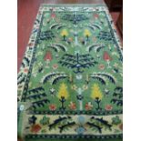 Green patterned rug, approximately 64 x 46 ins