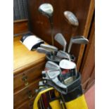 Pair of golf bags with club contents and manual trolley