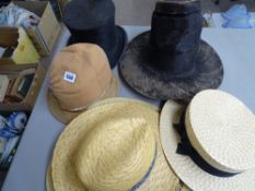 Selection of vintage hats including a Welsh Lady's hat, a top hat, a straw boater, two vintage