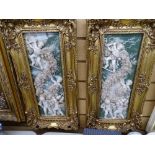 Pair of gilt framed composition pate-sur-pate type panels of cherubic figures