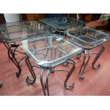 Parcel of four (two large, two small) ornate metal framed occasional tables with glass tops