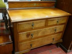 Four drawer walnut railback chest of drawers