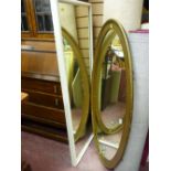 Large gilt framed oval mirror and a large wooden white painted rectangular mirror