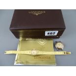 Longines yellow metal lady's watch and strap and an Omega lady's watch with stainless steel back