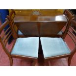 Mahogany inlaid single pedestal dining table with four chairs