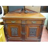 Polished wood railback sideboard with two drawers over two base cupboards having floral carvings