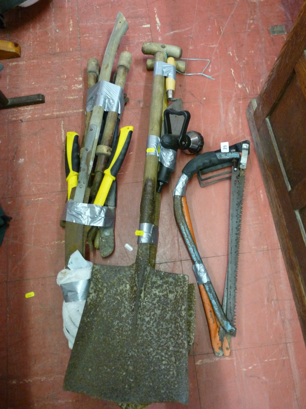 Parcel of long handled garden tools and bow saws