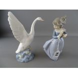 Two Nao figurines of a young girl with flowers and a goose taking flight