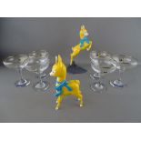 Two Babycham celluloid advertising figurines and a set of six Babycham glasses