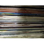 Case of vintage LP records, mostly big band compilation, some classical, names include Glenn Miller,