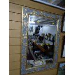 Modern swept gilt framed wall mirror