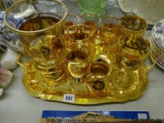 Gilt metal two handled tray and similar decorated lemonade set and other glassware etc