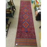 Meshwani carpet runner, red and blue ground, triple bordered with repeating central diamond pattern,